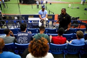 Rays outfielder Tommy Phan speaks with students in Poynter Institute's Write Field program on Jackie Robinson Day in 2019