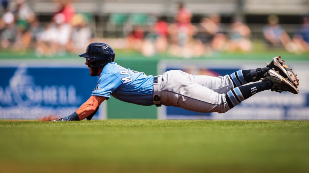 Miles Mastrobuoni dives into second base on a double against the Boston Red Sox